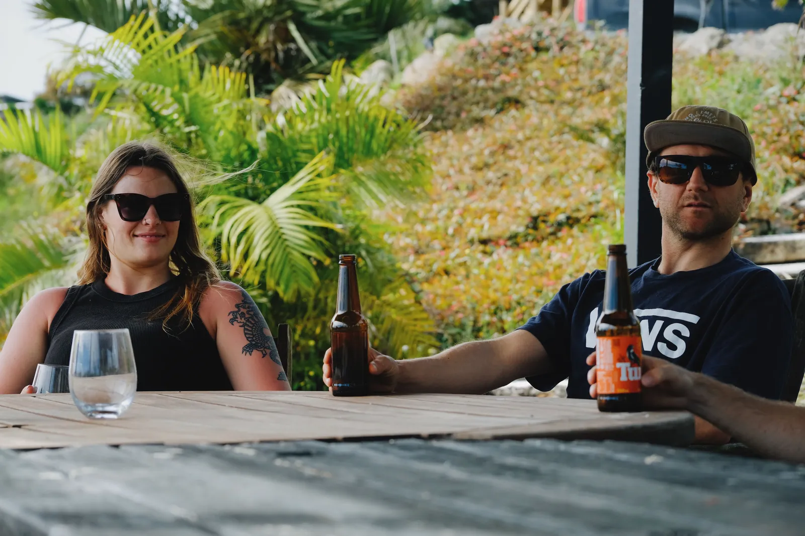 Guests sharing drinks at the eco pods outdoor table