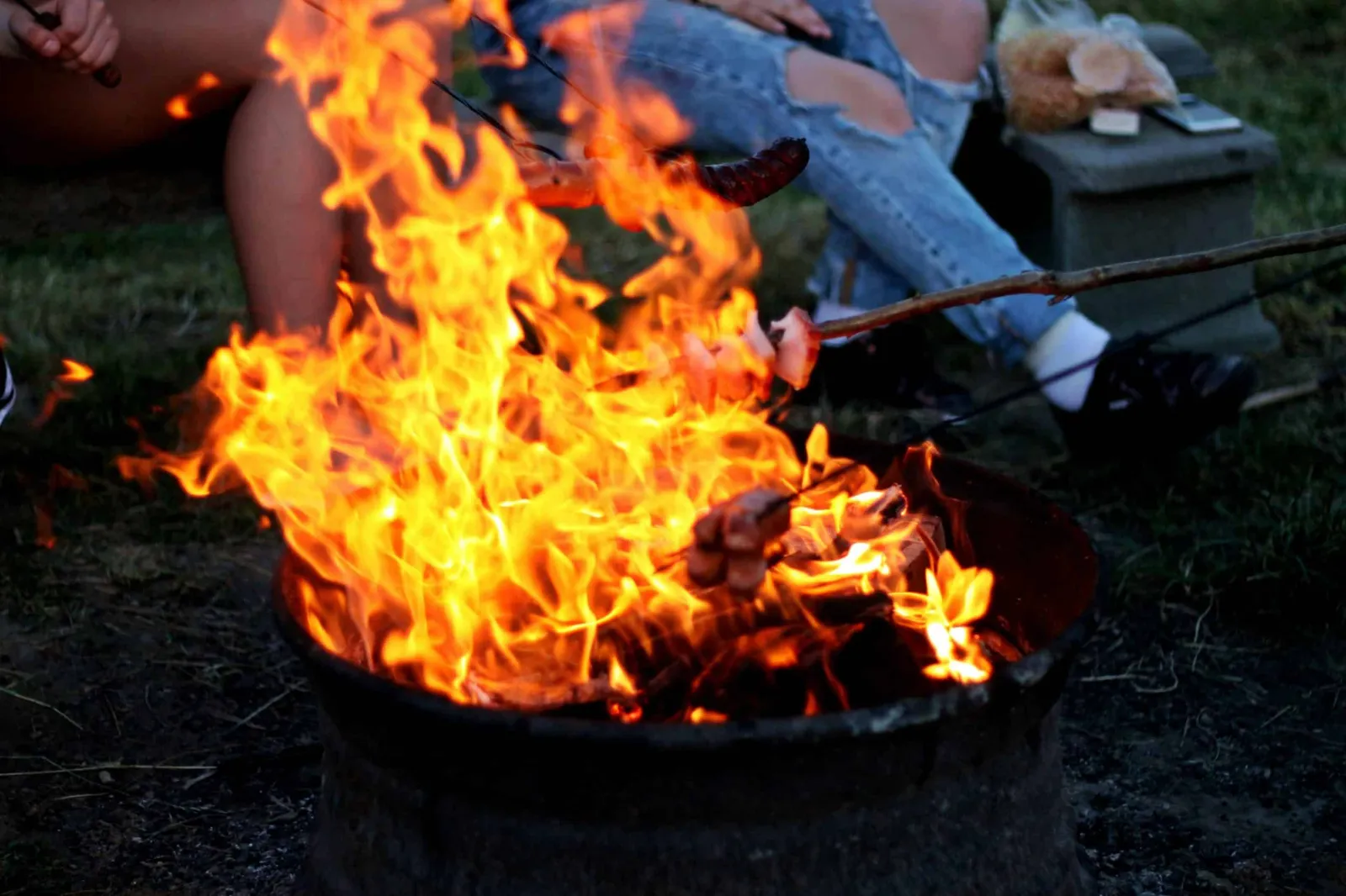 Campfire glowing at the surf tour basecamp